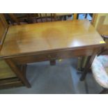 A Georgian mahogany fold over tea table having a single inset drawer with swan neck handle 29" H x