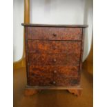 A miniature burr wood chest of five drawers on bracket feet, 9 2/8" x 7 1/2" x 4 2/8"