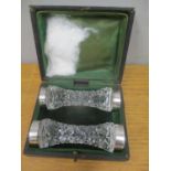 A pair of cased cut glass and silver rimmed cutlery rests