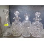 Four cut glass decanters to include a vintage Waterford decanter