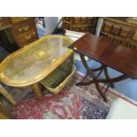 A modern inlaid wooden coffee table with inset glass and caned top, on square, tapering legs, a