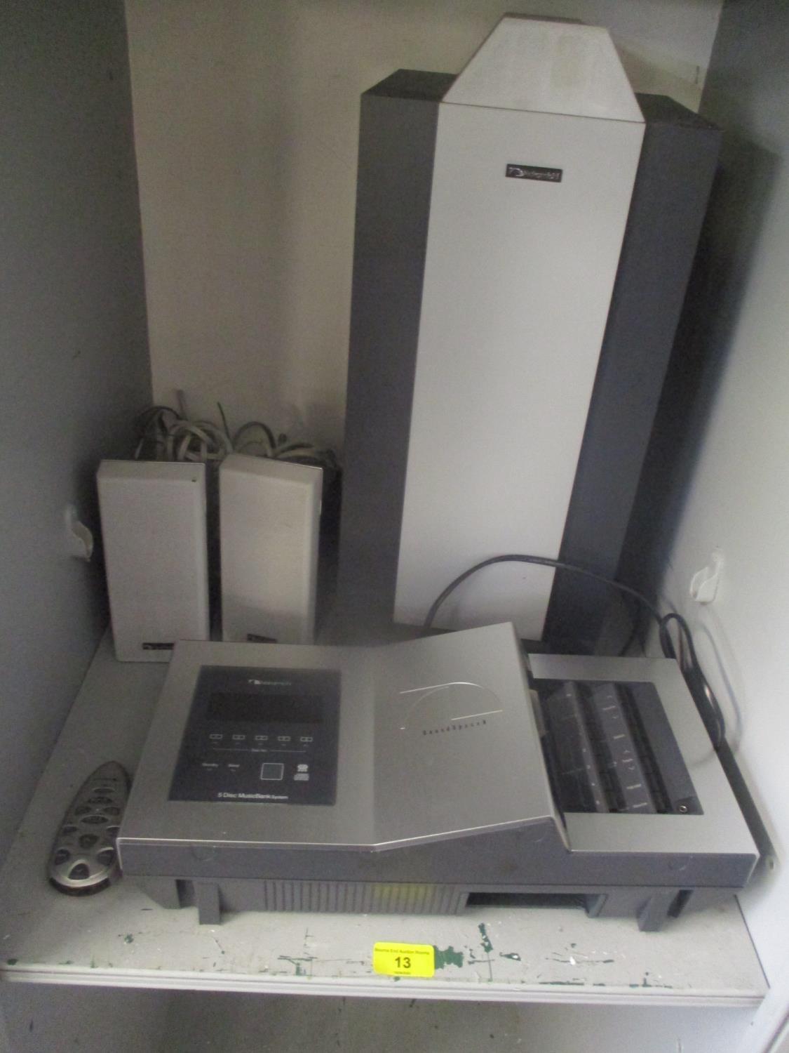 A Nakamichi Soundspace 8, five disc music bank system with speakers and subwoofer