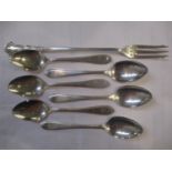 A set of six early 20th century silver teaspoons, together with a silver pickle fork, total weight