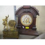 A late 19th century American walnut mantle clock, together with a gilt metal mantle clock fitted