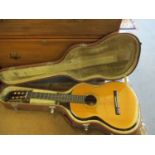 A Morris classic guitar and case