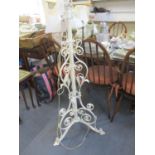 A mid 20th century painted wrought iron standard lamp