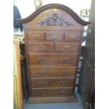 A reproduction arched top chest of drawers, having applied moulding and on a plinth base 67 1/2" H x