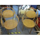 A pair of Bentwood armchairs with cane backs and seats Location: C