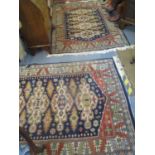 Two Kashmir blue ground rugs having multiguard borders and tasselled ends 78" x 55"