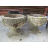 Two composition stone circular garden planters having floral swag decoration, 13 1/2"h x 15 1/4"w