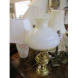 A quantity of 20th century table lights and mixed lampshades