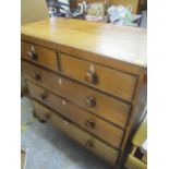 A 19th century oak chest of two short and three long drawers having inset ivory escutcheons and on