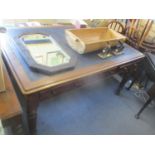 A Victorian mahogany library writing table having a leather top, inset drawers and fluted legs 29