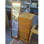 A modern pine bank of six drawers 43" H x 16 1/2" W, together with a floor standing mirror 59" H x