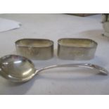 Two silver machine turned napkin rings and a silver spoon