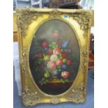 A large oil on board depicting a still life in an ornate gilt frame 35" x 23", framed