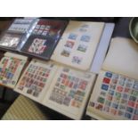 The Disney World of postage stamps, together with an album of first day covers and three albums of