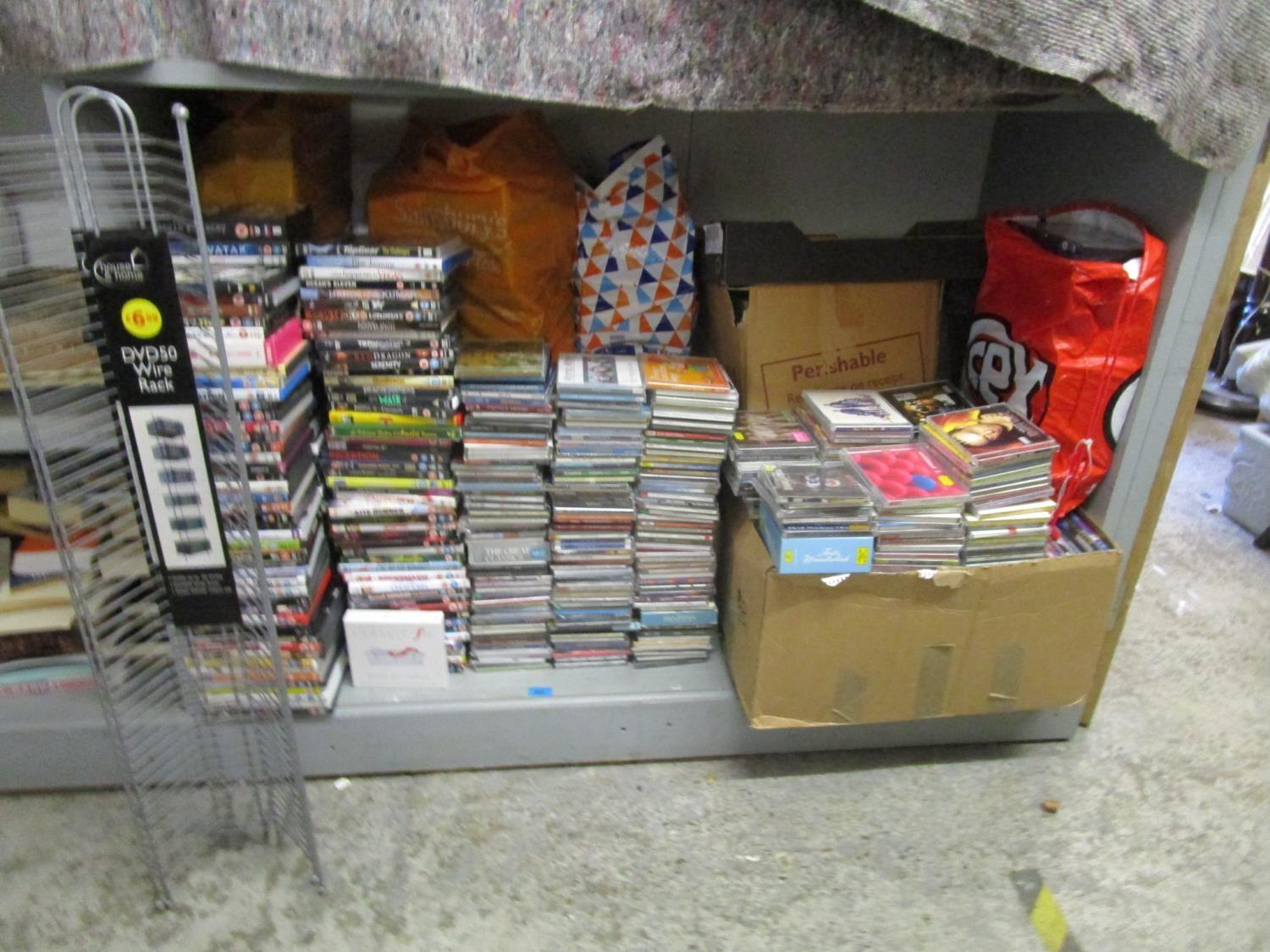 1300 DVDs, CDs, cassettes and two CD stands