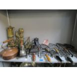 A mixed lot of flat iron trinkets, along with three flat irons, an Eccles brass miner's lamp, a