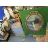 A Victorian gilt gesso framed mirror and a later gilt framed mirror surmounted by an eagle
