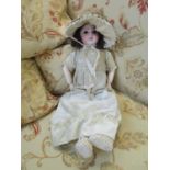 Early 20th century French Jumeau bisque headed doll with dark brown sleeping eyes, open mouth with