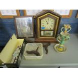 A Regency toilet mirror, an American clock, two majolica candlesticks, a porcelain ornament of a