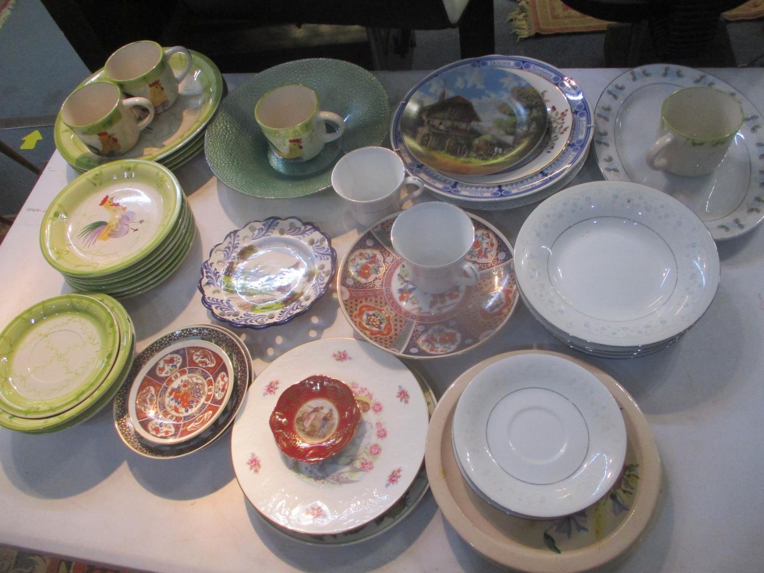 A mixed lot to include collectors plates, a glass bowl, Russian Fairy Tales plates and other items