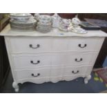 A reproduction white painted chest of three long drawers standing on short cabriole legs 35 1/2" H x