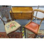 An early 20th century mahogany three drawer side table, together with two mixed 20th century chairs