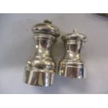 A silver salt and a silver pepper grinder Location: CAB