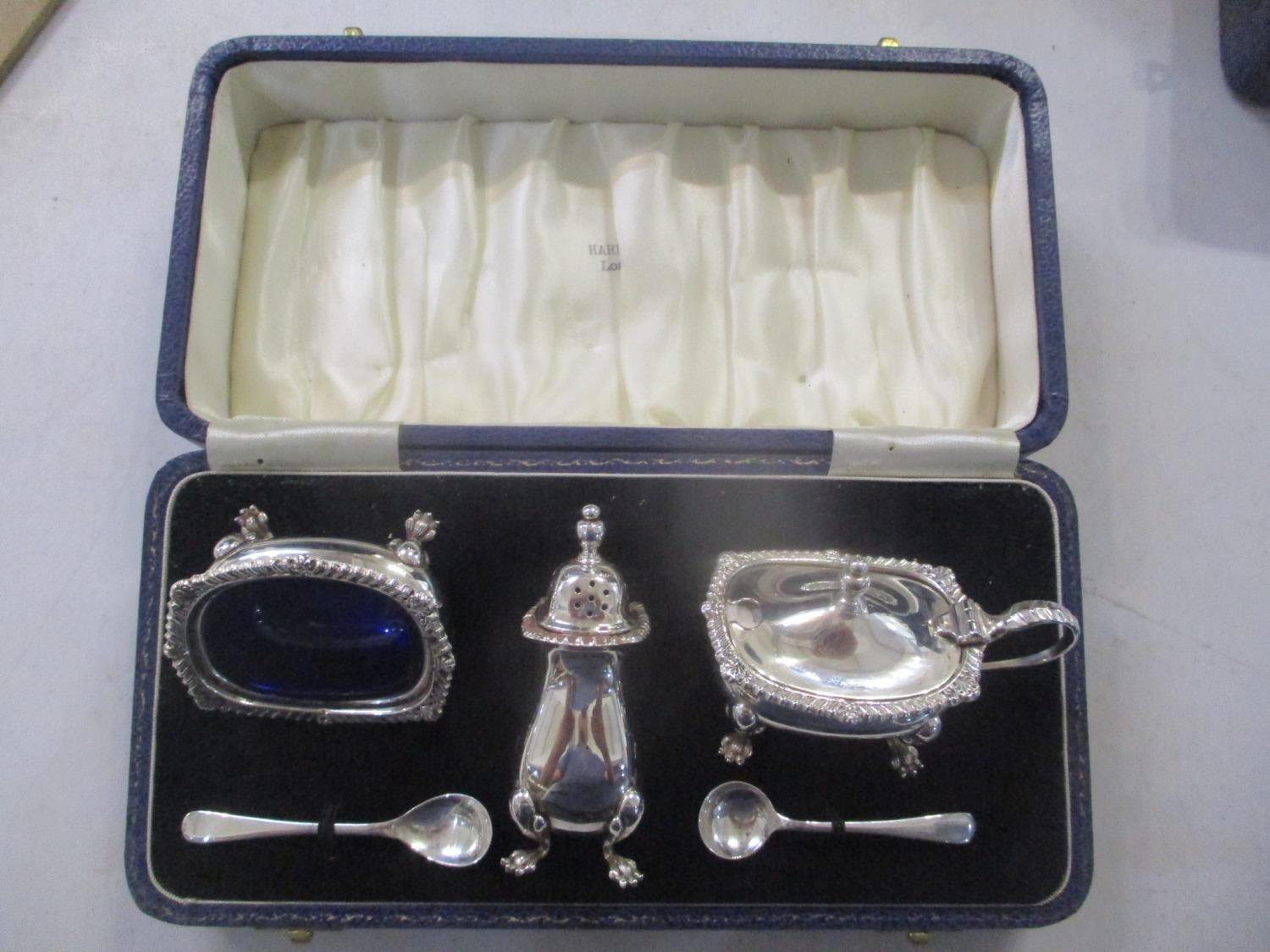 An early 20th century set of silver condiments in a Harrods box