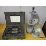 A military wrench and de-bulleting kit EOD cartridge operated cased XL58-E1 and a microscope