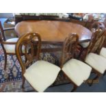 A John E Coyle Ltd reproduction walnut stained oval dining table, together with a matching corner