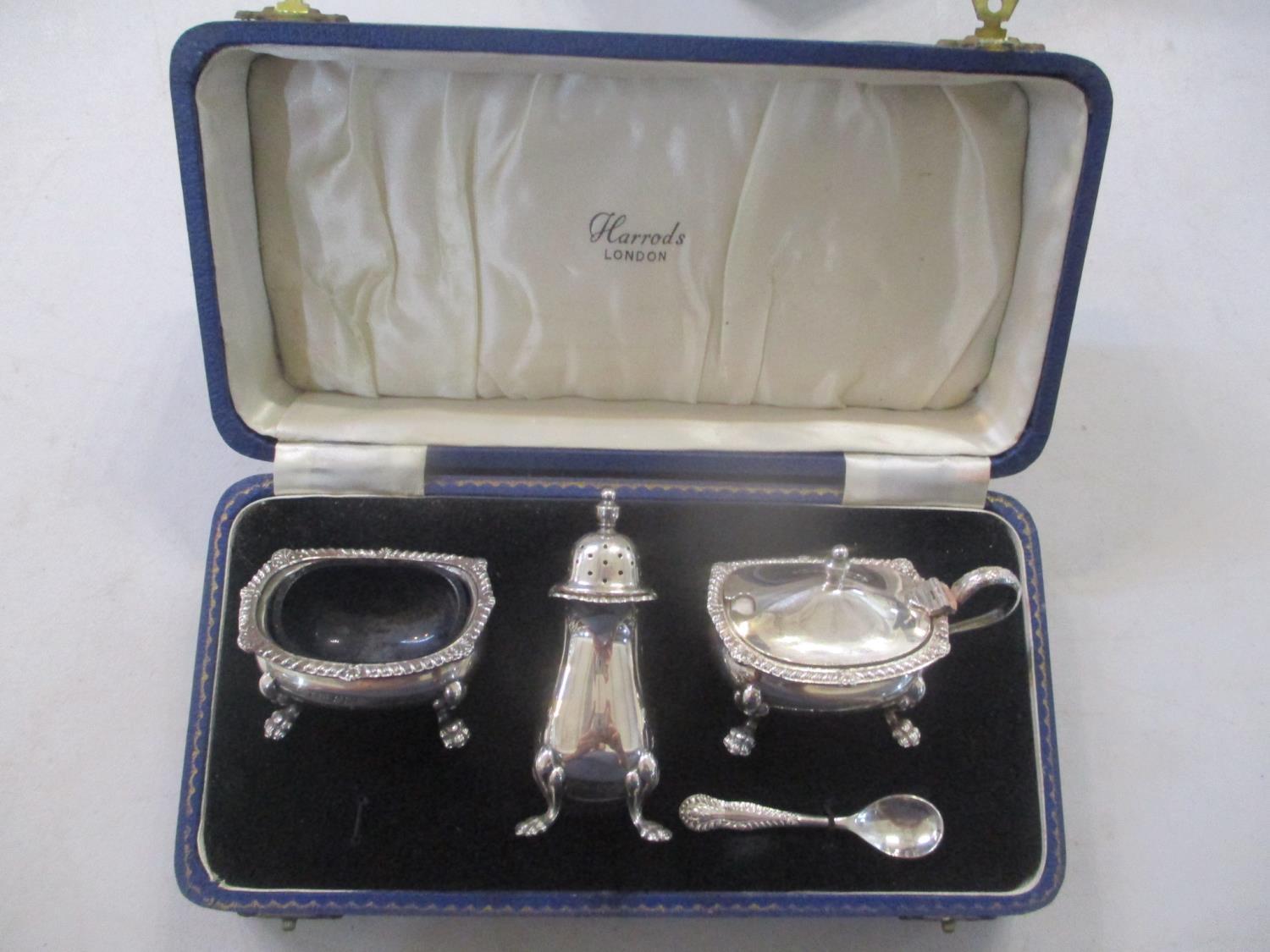 An early 20th century set of silver condiments in a Harrods box