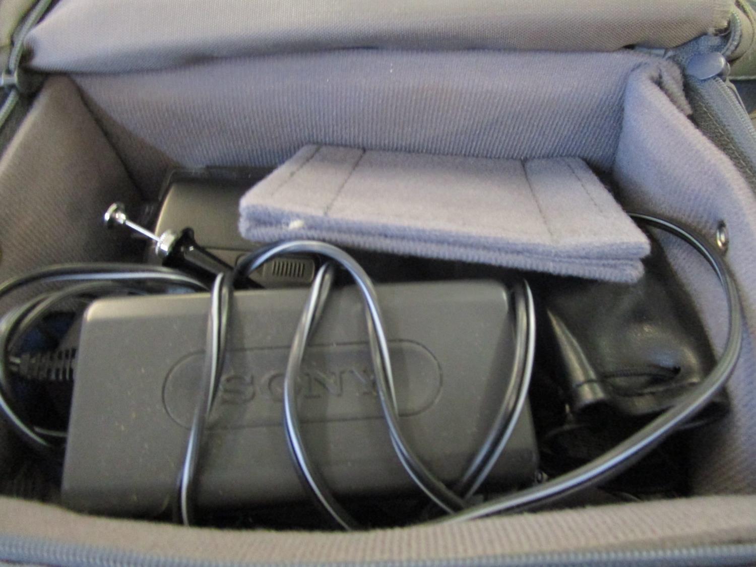 A Sony Digital Handy camcorder in case and a camera bag with various lenses, along with an - Image 3 of 3