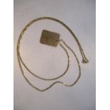 A 9ct gold tag pendant on an 18ct gold necklace
