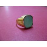 A 14ct gold gents signet ring set with a green stone, total weight 5.4g