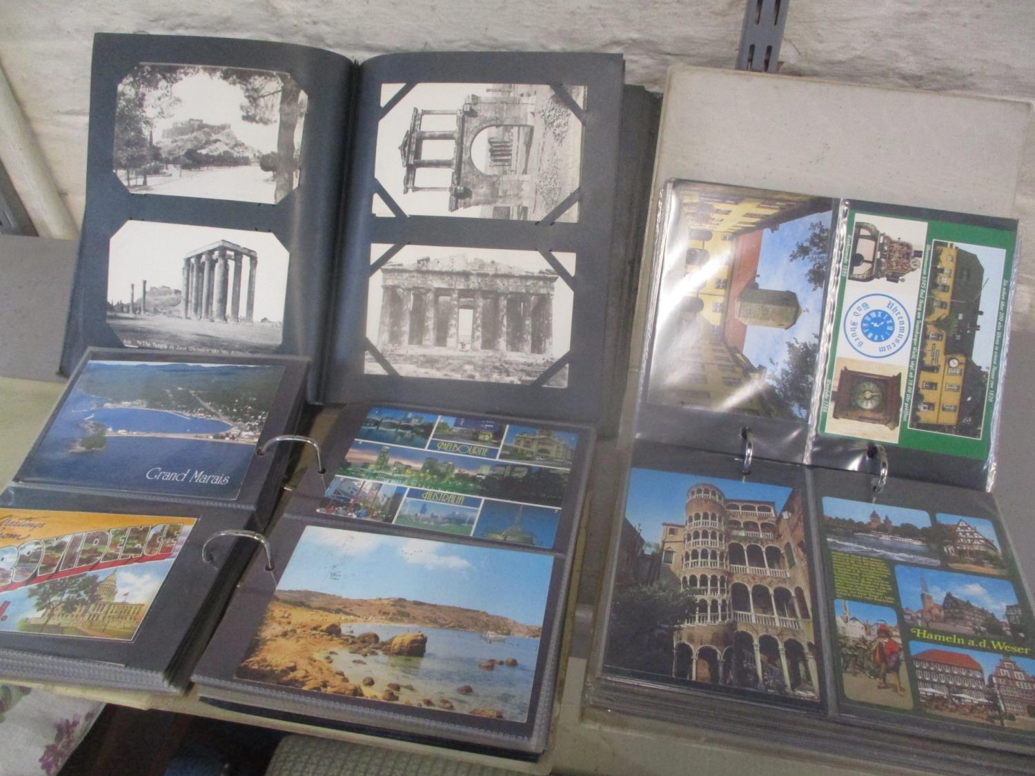 Three albums of early 20th century and later postcards