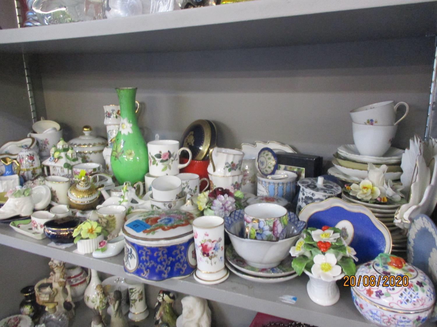 Continental and British porcelain trinkets, ornaments and dressing table items, together with part