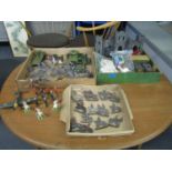 A selection of vintage diecast, hollow lead, and lead military vehicles, soldiers, cowboys, some