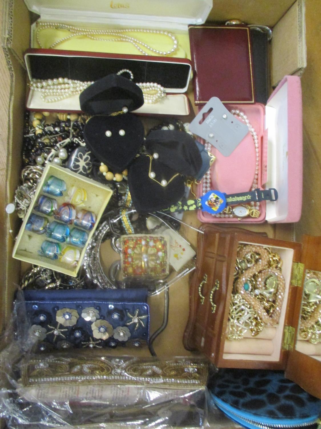 A mixed lot of costume jewellery to include beaded necklaces, earrings, watches and other items