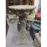 A composition stone garden bird bath decorated with grapevines 34 1/4" H