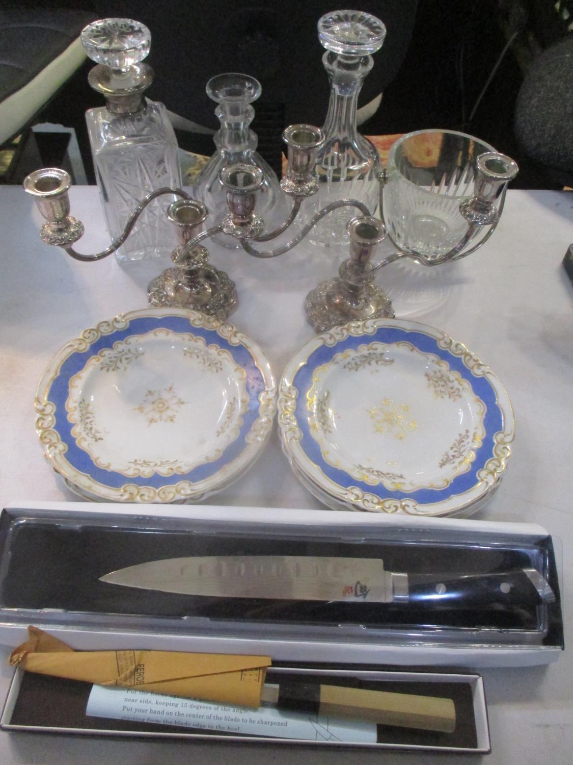 A mixed lot to include three decanters, one having a silver collar, a glass bowl with a silver