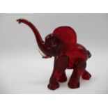 Attributed to Vetreira Artistica Barovier or Martinuzzi, a small red glass model of an elephant