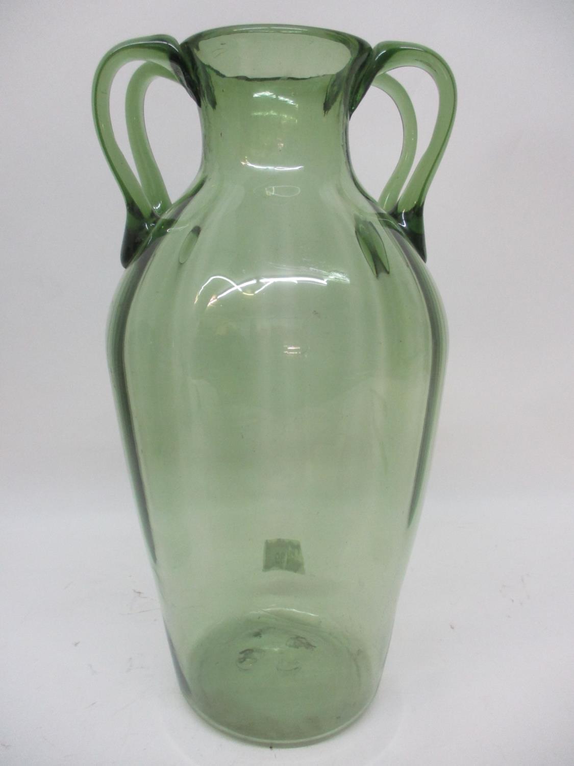 In the style of Napoleon Martinuzzi (Venini & C) - a green tinted glass vase with vertical moulded