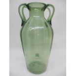 In the style of Napoleon Martinuzzi (Venini & C) - a green tinted glass vase with vertical moulded