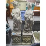 A pair of composition stone garden statues of Grecian females on square bases 38 1/2" H