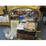 A contemporary gilt framed overmantel mirror, a framed and glazed fashion print, two suitcases,