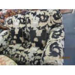 A two-seater and matching three-seater sofa in a black ground fabric having Grecian urns and