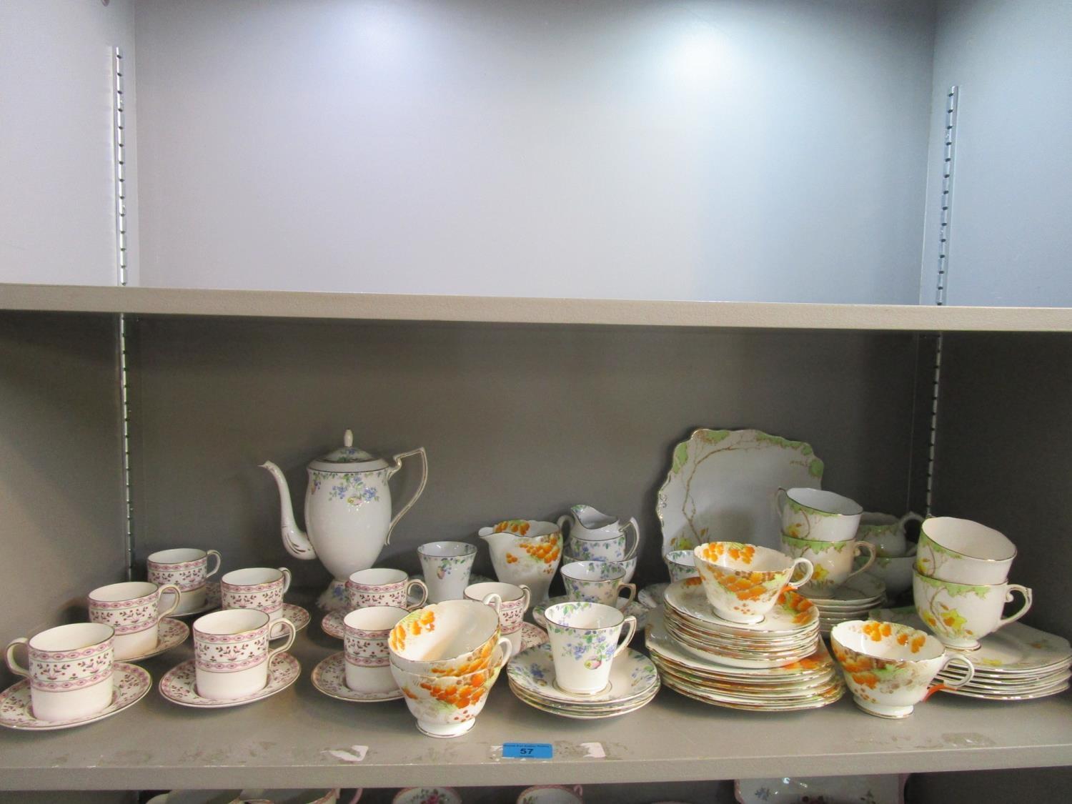 A selection of porcelain part tea and coffee sets to include Shelley Mimosa pattern tea cups,